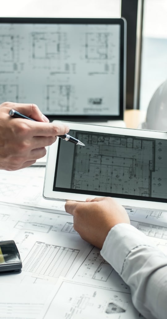 a person points to a floor plan on a tablet
